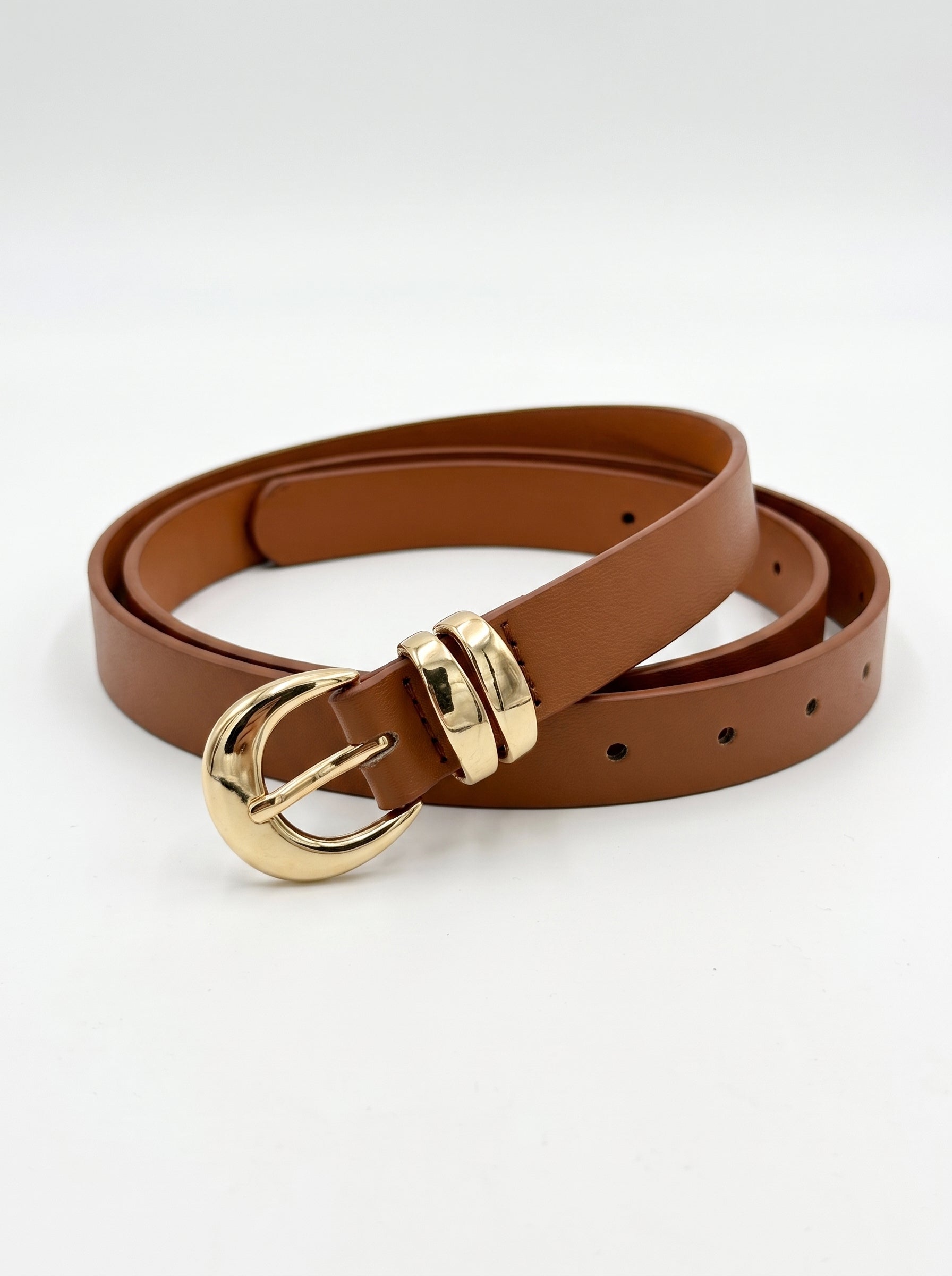 A brown leather belt with a polished gold-tone buckle, shown coiled on a clean white background.