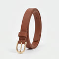 A brown leather belt with a gold-tone metal buckle, coiled and standing upright on a clean white background.