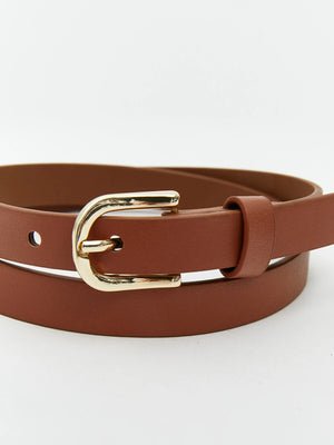 A brown leather belt with a polished gold-tone metal buckle, coiled on a clean white background.