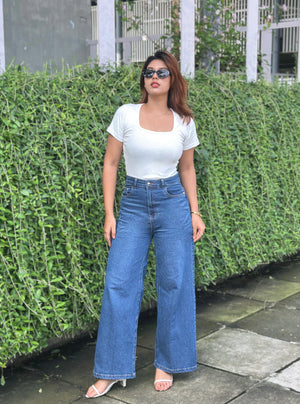 Women's Trendy Wide Leg Jeans in Dark Blue with high-waist fit, premium denim fabric, front and back pockets, and belt loops by Trendy Buzz.