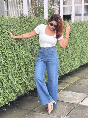 Women's Trendy Wide Leg Jeans in Dark Blue with high-waist fit, premium denim fabric, front and back pockets, and belt loops by Trendy Buzz.