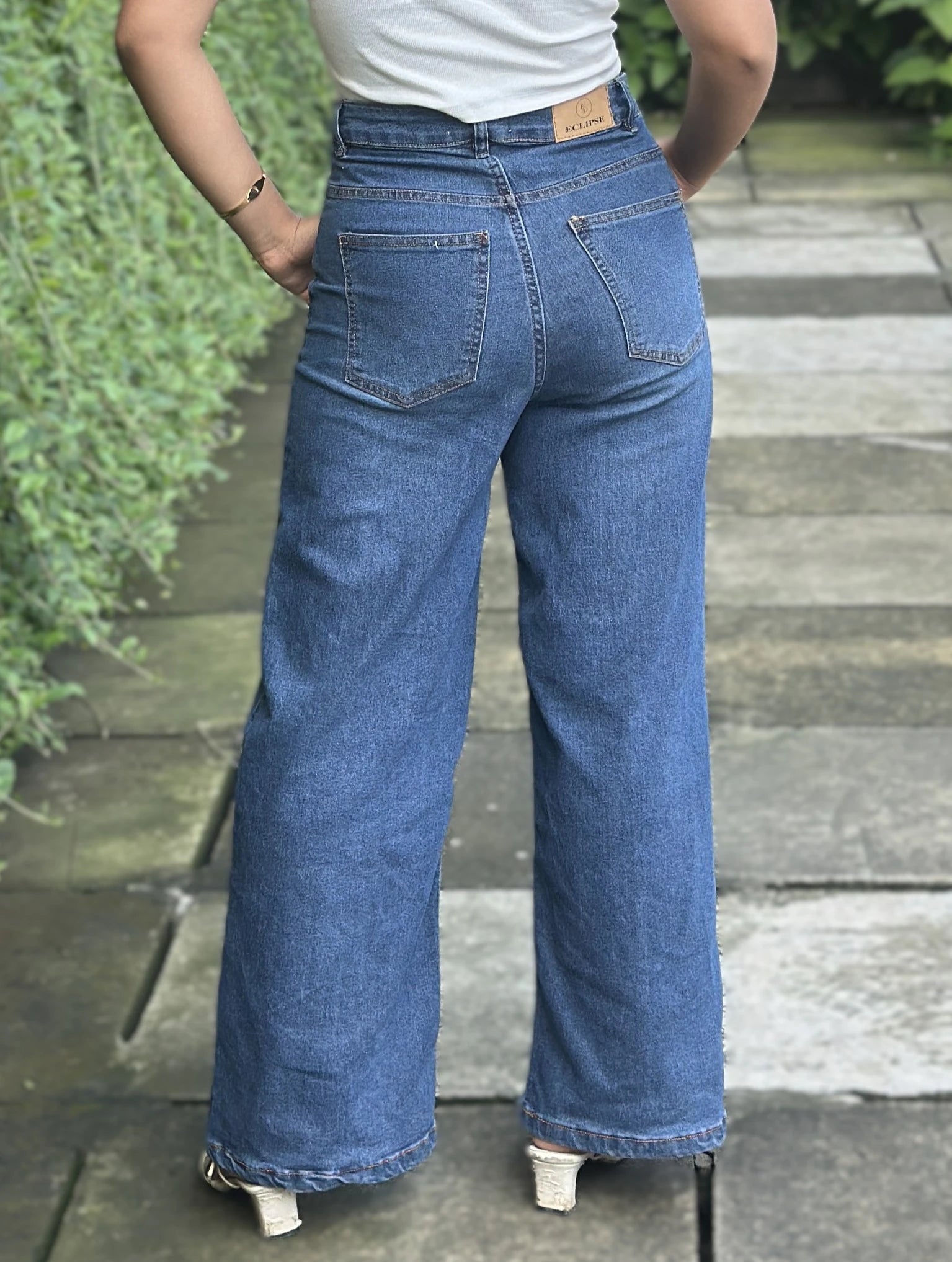 Women's Trendy Wide Leg Jeans in Dark Blue with high-waist fit, premium denim fabric, front and back pockets, and belt loops by Trendy Buzz.