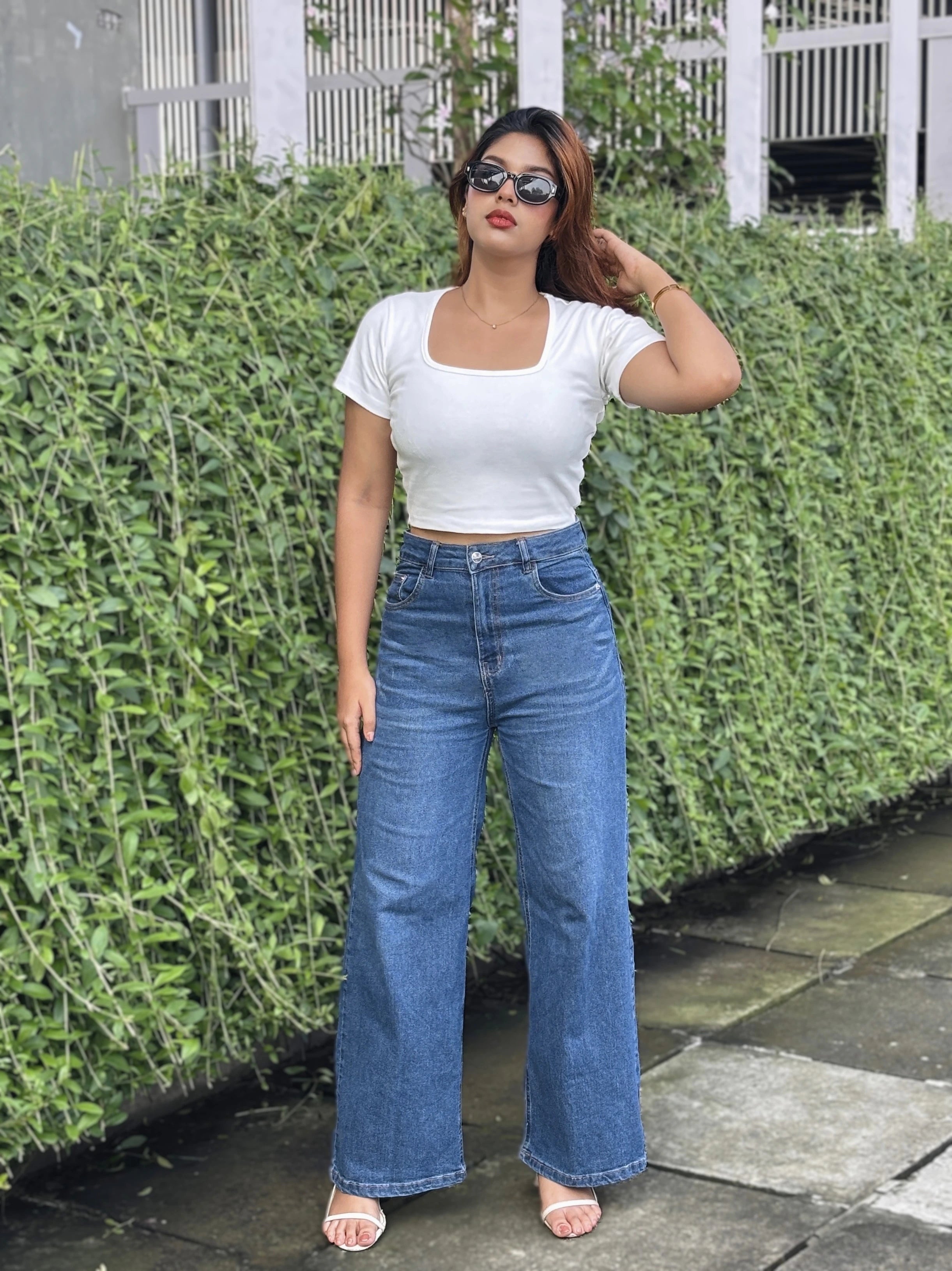 Women's Trendy Wide Leg Jeans in Dark Blue with high-waist fit, premium denim fabric, front and back pockets, and belt loops by Trendy Buzz.