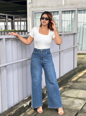 Women's Trendy Wide Leg Jeans in Dark Blue with high-waist fit, premium denim fabric, front and back pockets, and belt loops by Trendy Buzz.