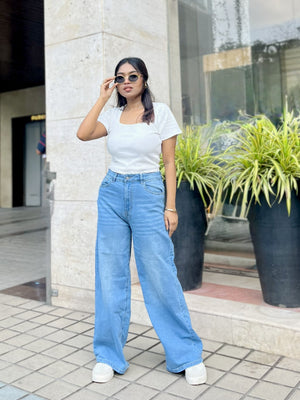 Women's Trendy Wide Leg Jeans in Light Blue with high-waist fit, front and back pockets, belt loops and relaxed wide-leg silhouette by Trendy Buzz.