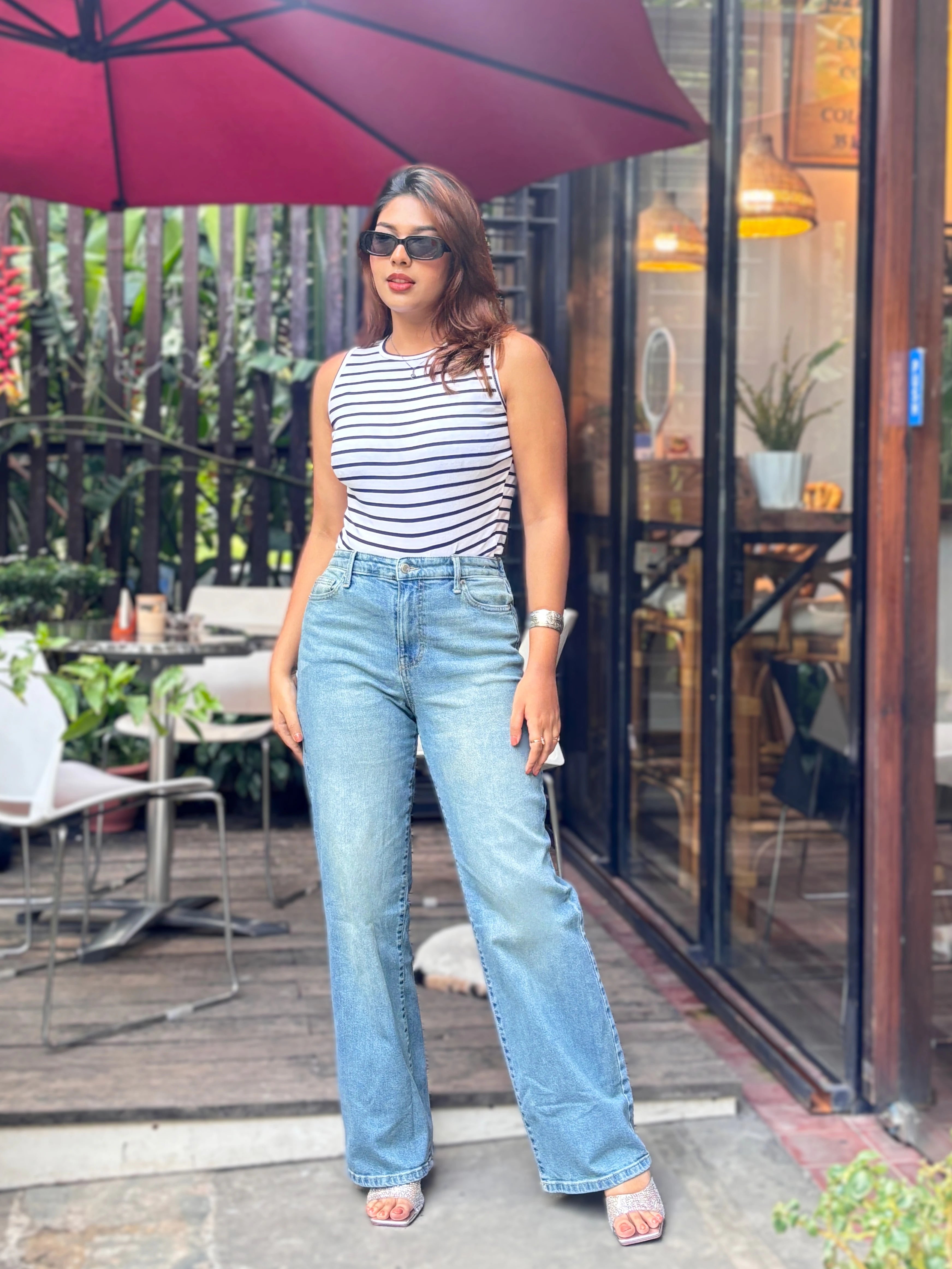 Women's Trendy Wide Leg Jeans in Mid Tint Blue with high-waist fit, premium denim fabric, front and back pockets, and belt loops by Trendy Buzz.
