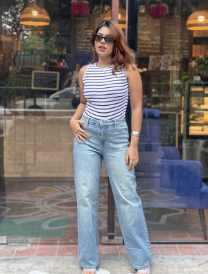 Women's Trendy Wide Leg Jeans in Mid Tint Blue with high-waist fit, premium denim fabric, front and back pockets, and belt loops by Trendy Buzz.
