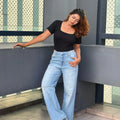 Women's Wide Leg Baggy Jeans in Light Blue with high-waist fit, back elastic waistband, front and back pockets, belt loops, and premium denim fabric by Trendy Buzz