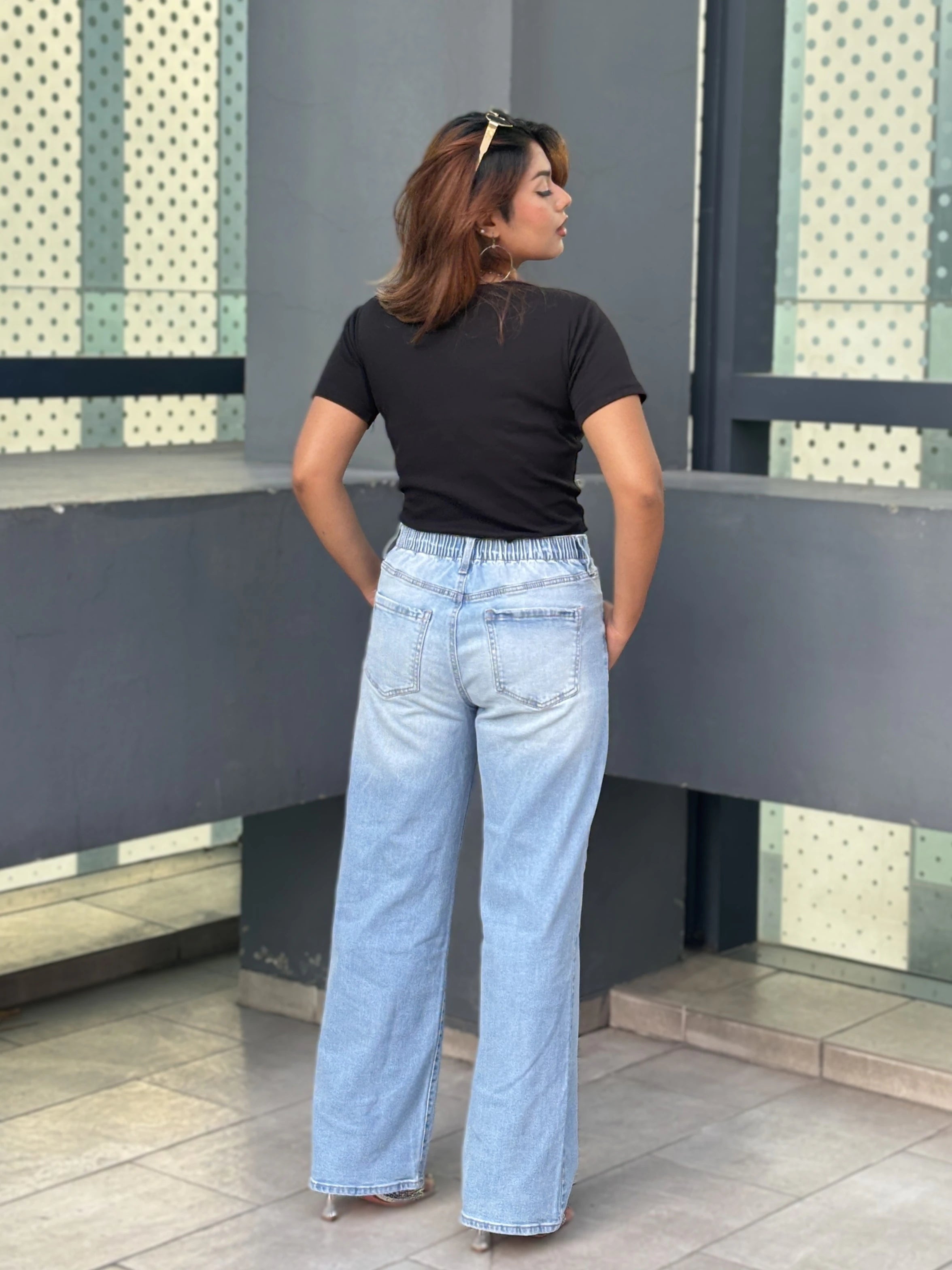 Women's Wide Leg Baggy Jeans in Light Blue with high-waist fit, back elastic waistband, front and back pockets, belt loops, and premium denim fabric by Trendy Buzz