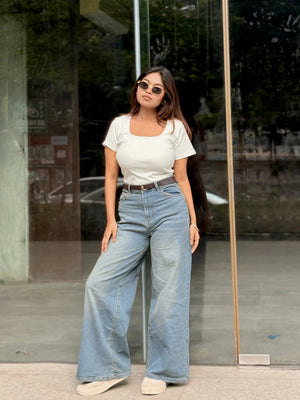 Women's Wide Leg Baggy Jeans in Mid Blue with high-waist fit, back elastic waistband, front and back pockets, belt loops, and premium denim fabric by Trendy Buzz