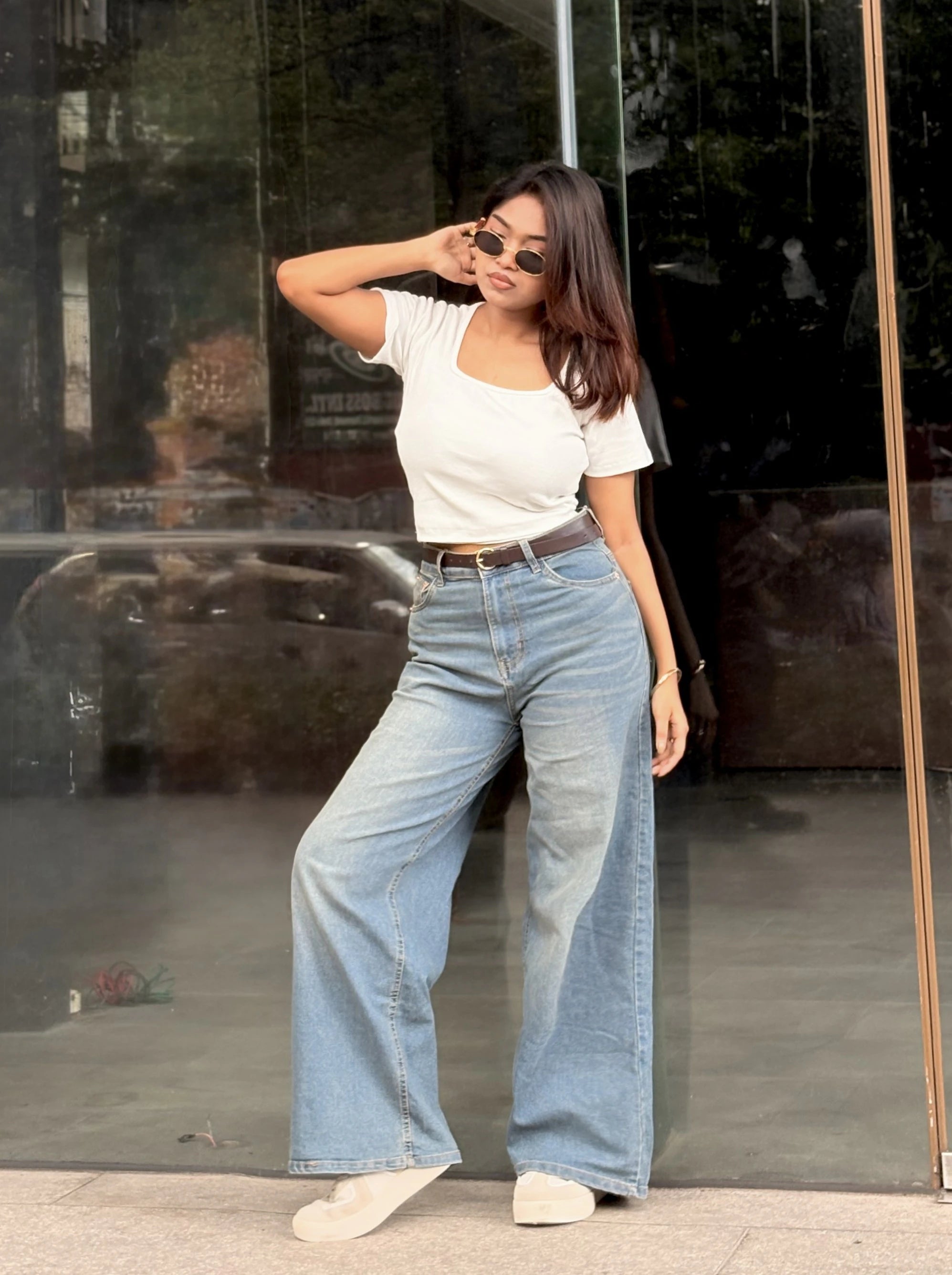 Women's Wide Leg Baggy Jeans in Mid Blue with high-waist fit, back elastic waistband, front and back pockets, belt loops, and premium denim fabric by Trendy Buzz