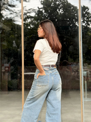 Women's Wide Leg Baggy Jeans in Mid Blue with high-waist fit, back elastic waistband, front and back pockets, belt loops, and premium denim fabric by Trendy Buzz