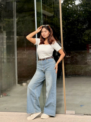 Women's Wide Leg Baggy Jeans in Mid Blue with high-waist fit, back elastic waistband, front and back pockets, belt loops, and premium denim fabric by Trendy Buzz