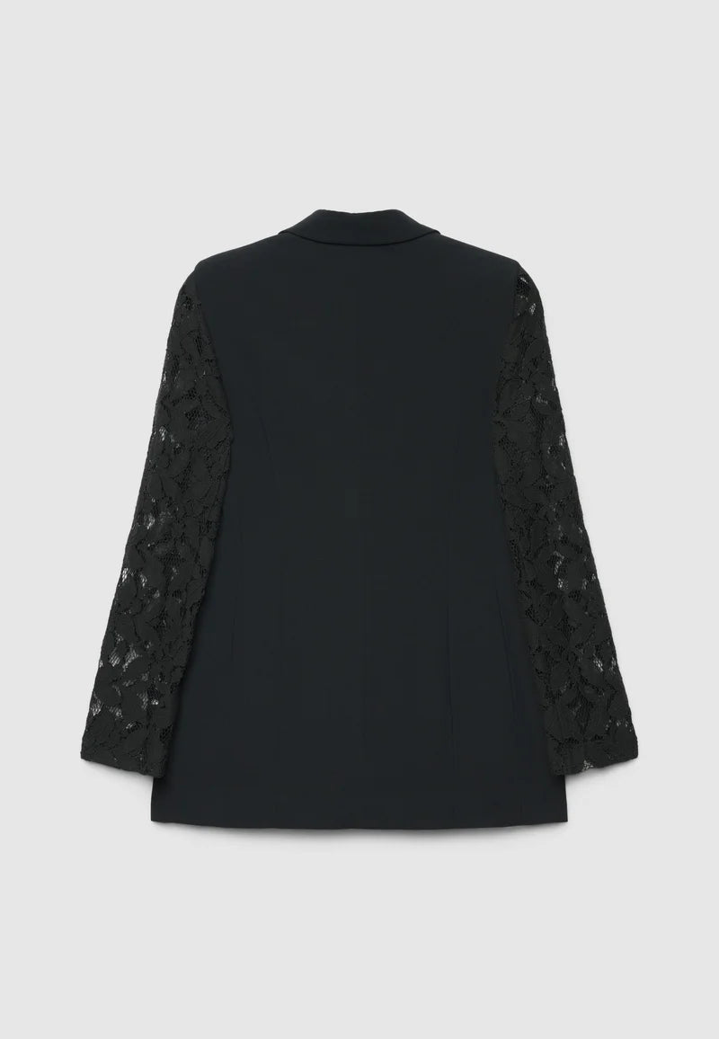 A black long-sleeve blazer shown from the back, featuring solid black fabric on the back panel and intricate black lace detailing on the sleeves, set against a light gray background.